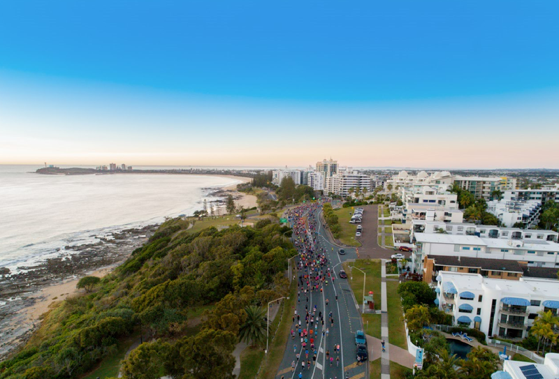 Sunshine Coast Marathon - drone shot of racers on the coastal road route