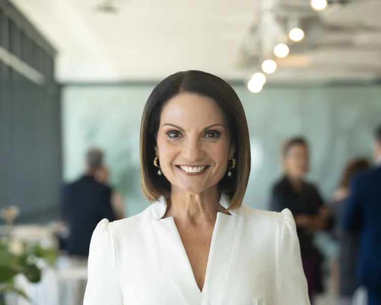 Headshot of Sunshine Coast Council Mayor Rosanna Natoli, smiling in white top. 