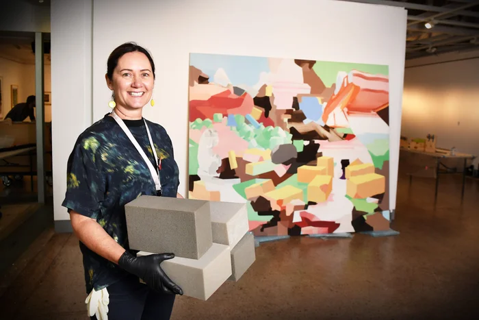 Nina-Shadforth-Sunshine-Coast-Art-Collection-curator-sets-up-for-the-Latest-Greatest-II-exhibition-at-Caloundra-Regional-Gallery-scaled.jpg