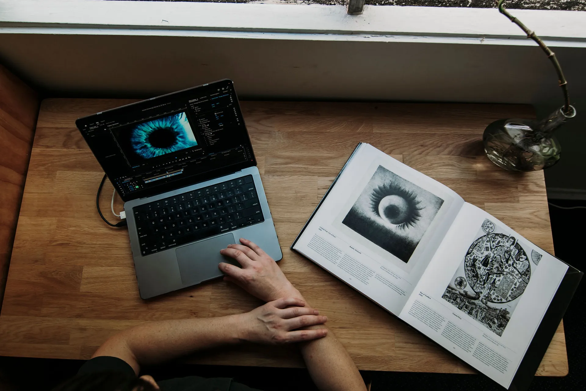 Project 24 residency - images shows a laptop and a book open on a table