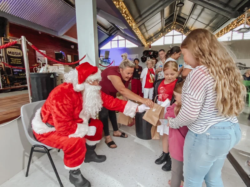 Santa greeting people at Nambour Tramfest