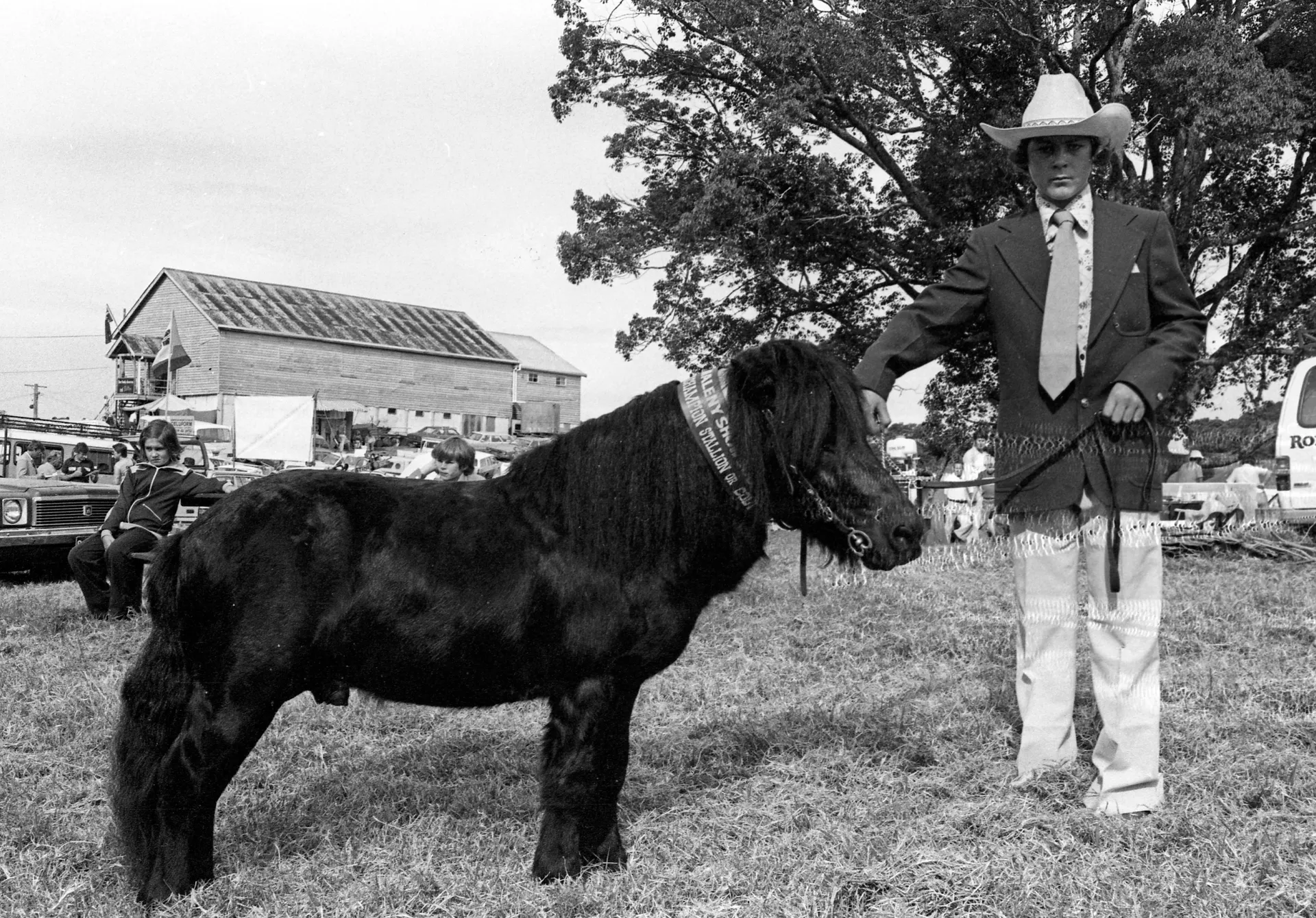 Winner of the champion stallion or colt section at the Maleny Show 1971 - Man holding a small horse