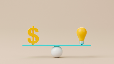 balance scale with a light bulb one end and a dollar sign the other