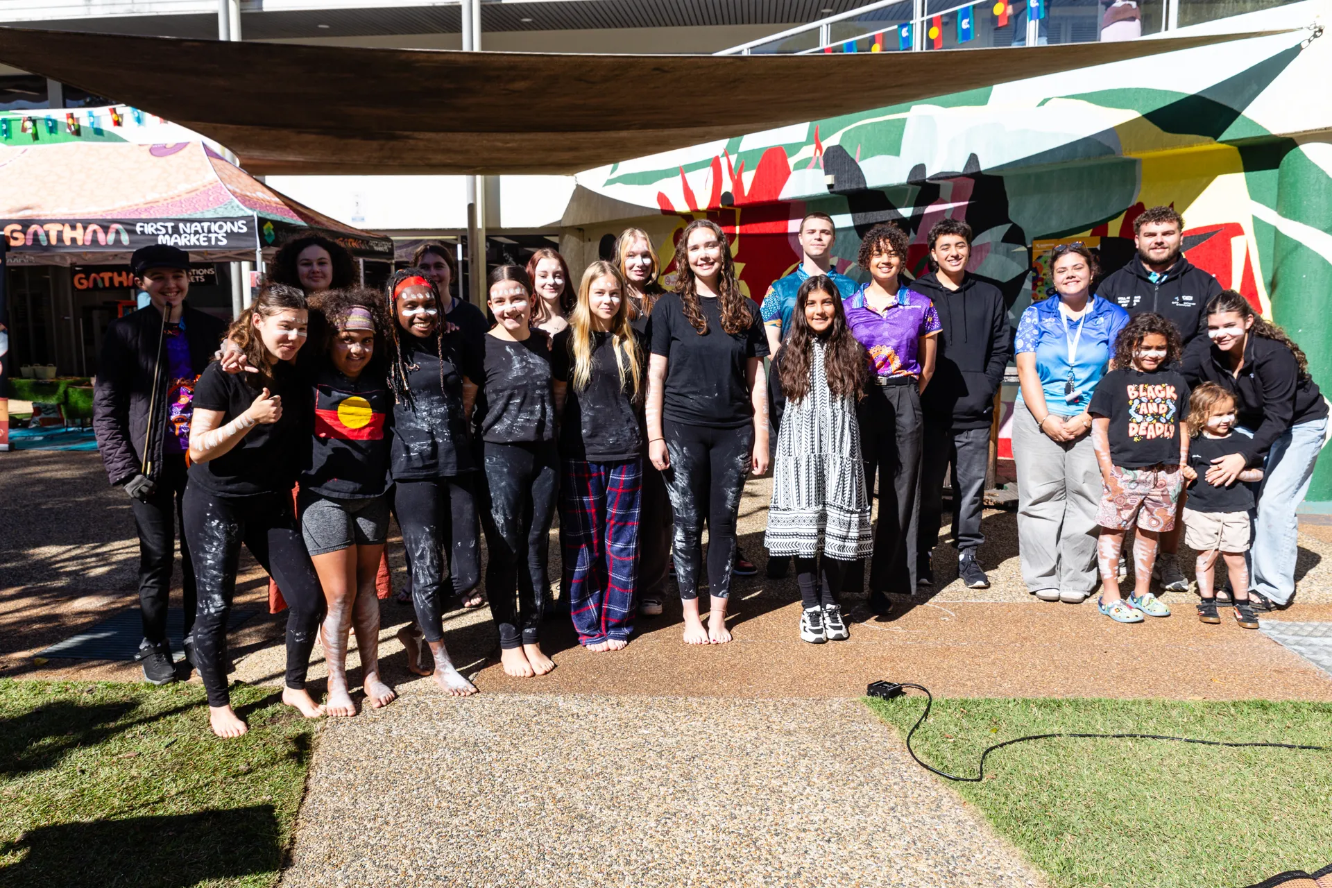 The youth involved in making the event happen gather for a group photo.
