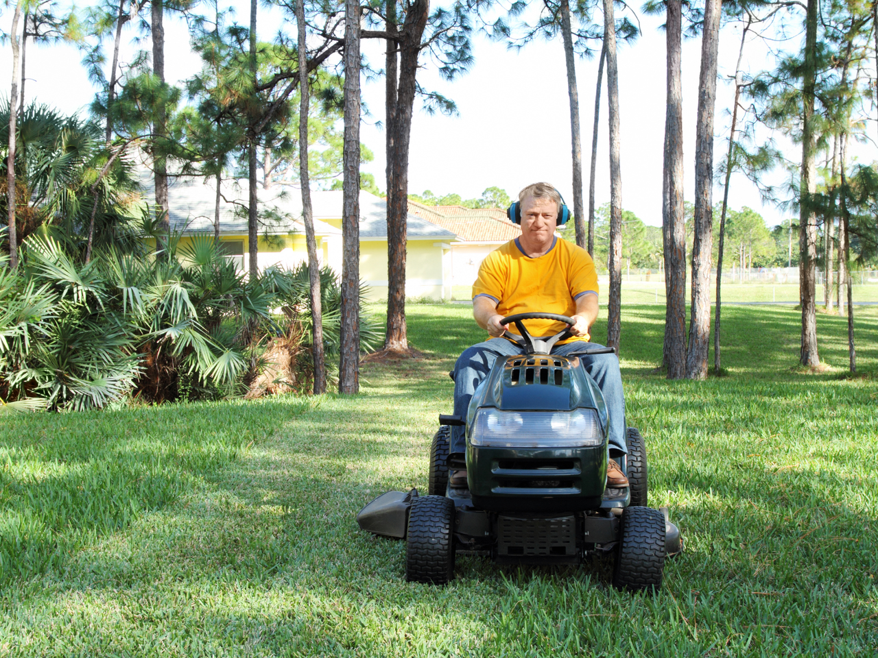 man on a ride on mower