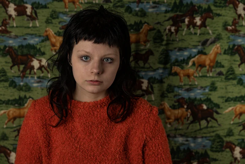 Teddy Horton, dressed in red jumper 