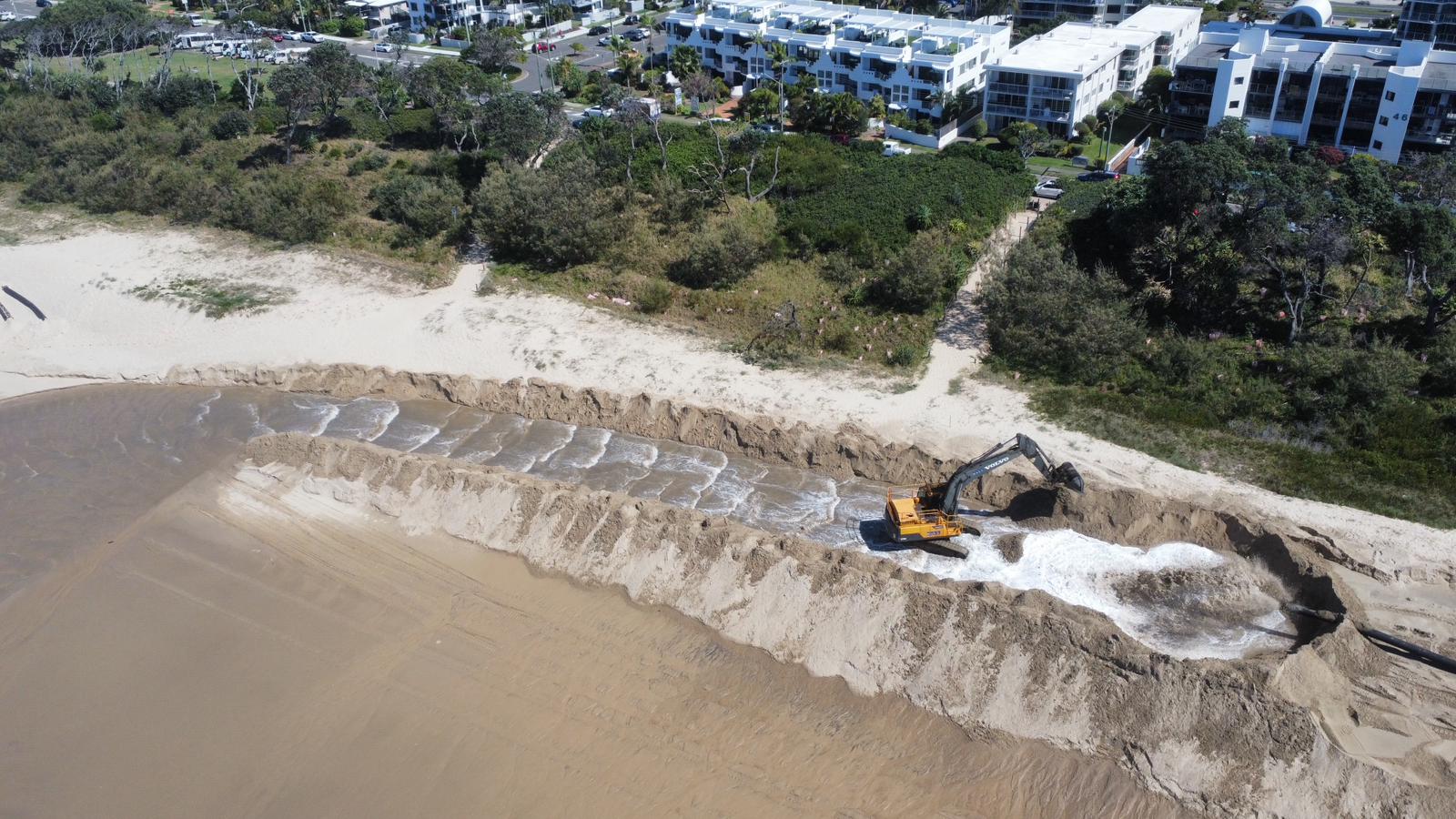 excavator on the beach