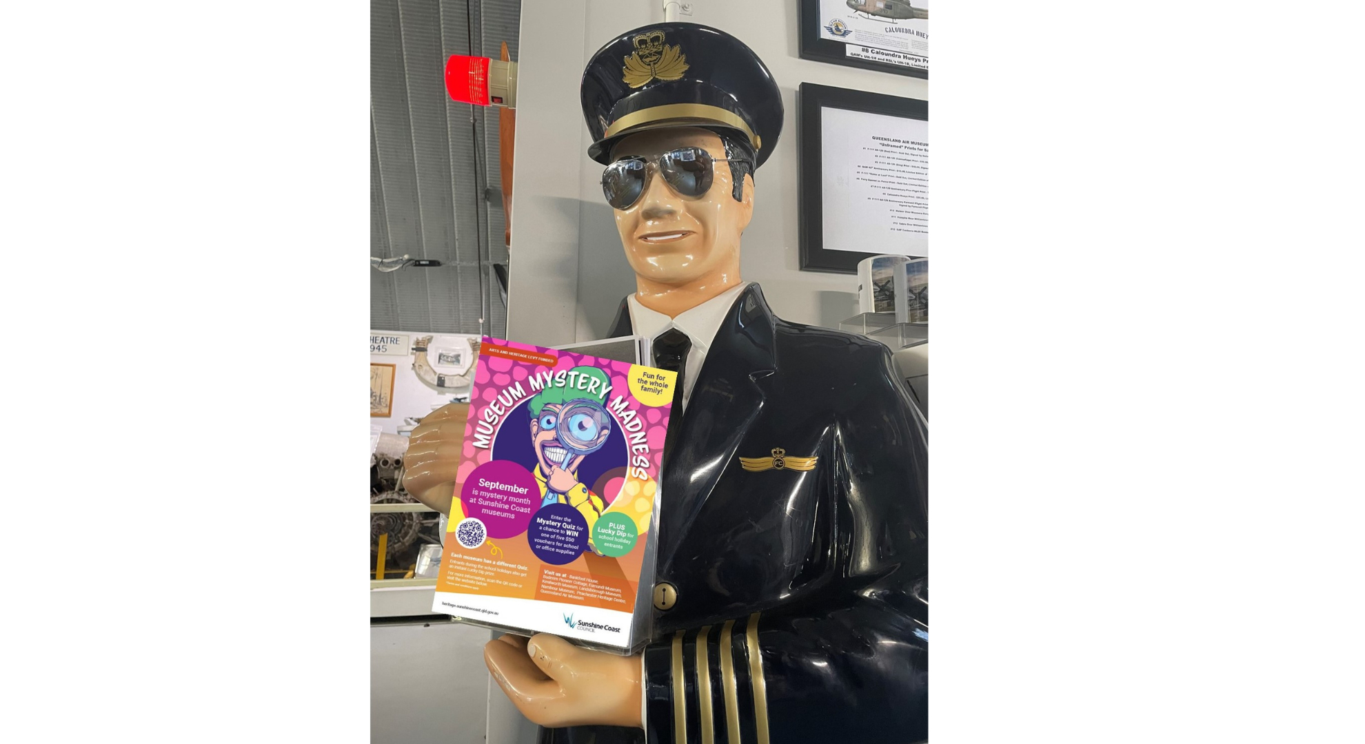 Queensland Air Museum model pilot holding a quiz box