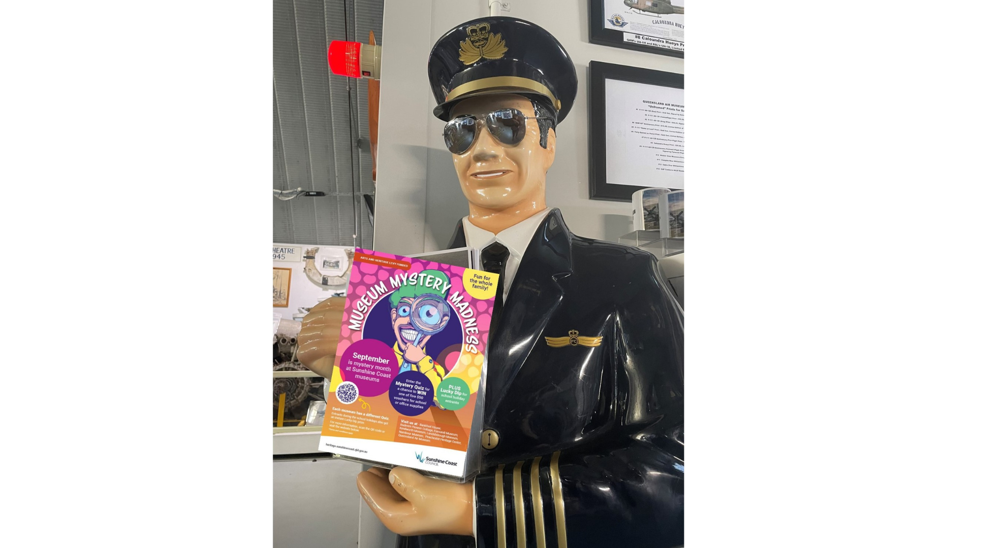 Queensland Air Museum model pilot holding a quiz box