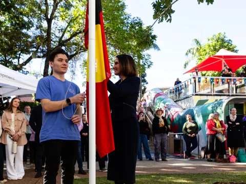 Community gathers for flag raising and cultural celebrations