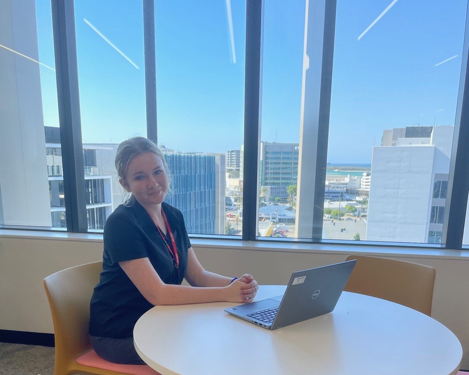 Female high school student working in administration in office building