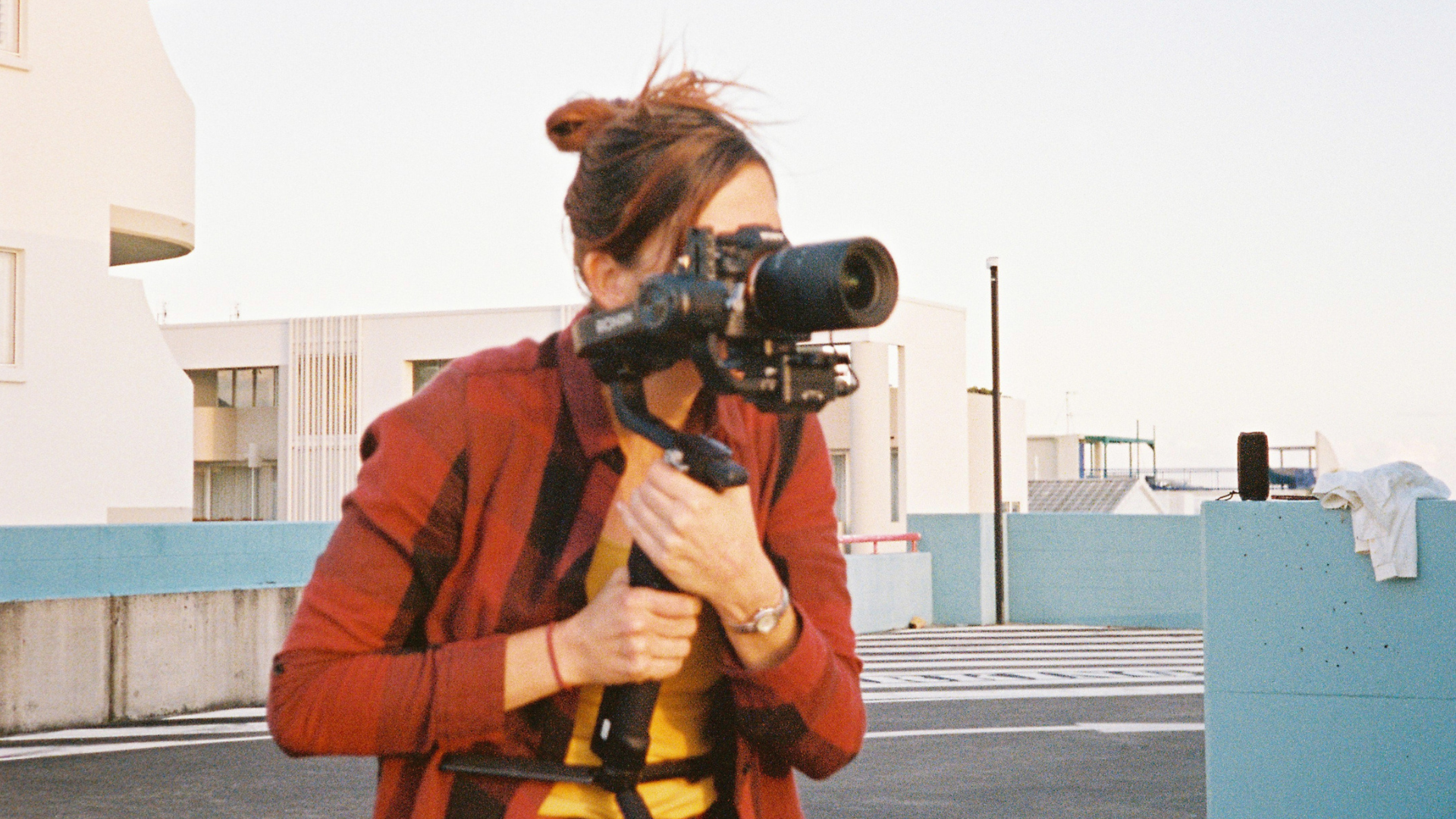 Photographer looking through the lens of a camera