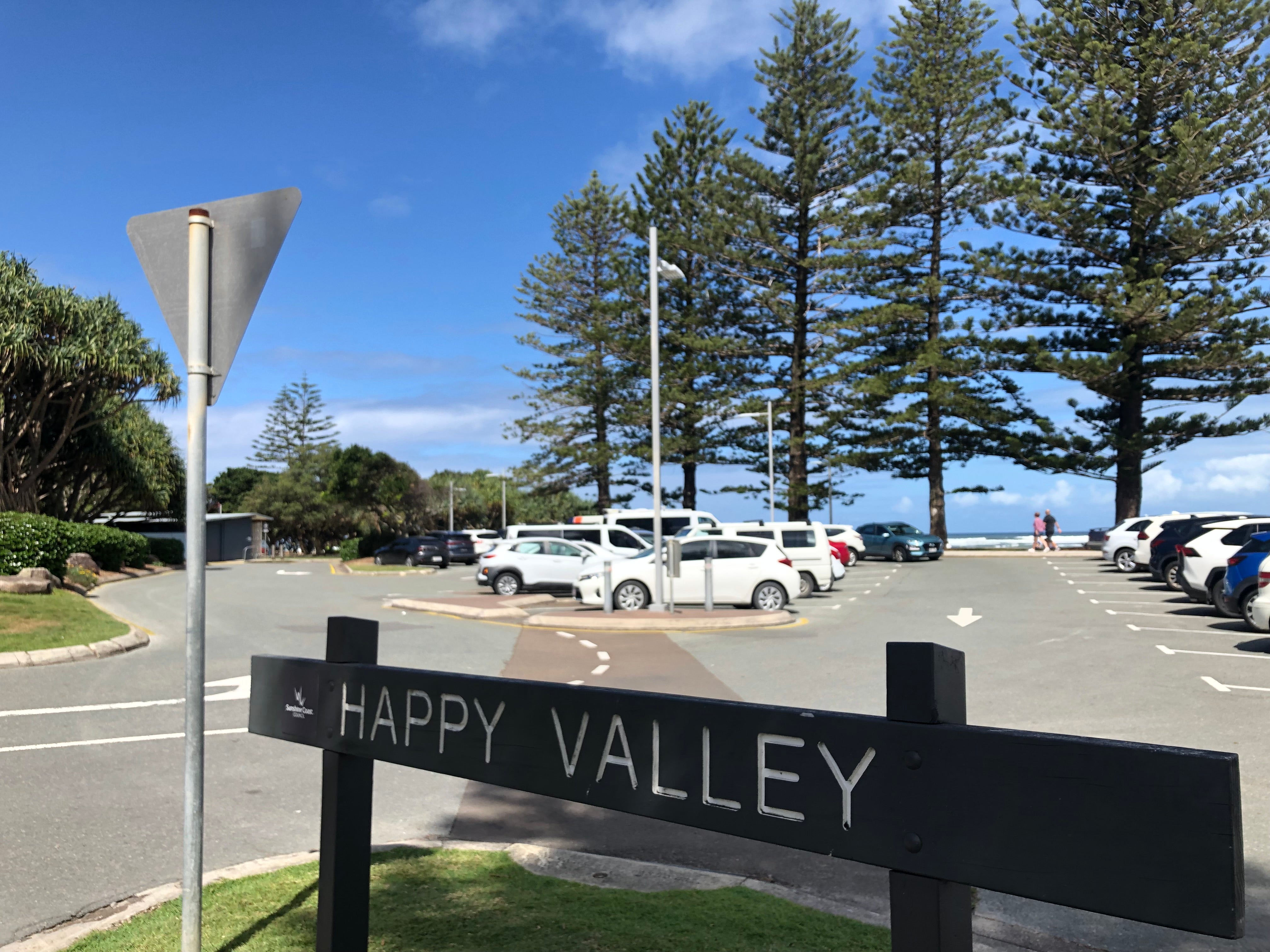 Signage reads Happy Valley, with the car park in the background and Norfolk trees behind as well.