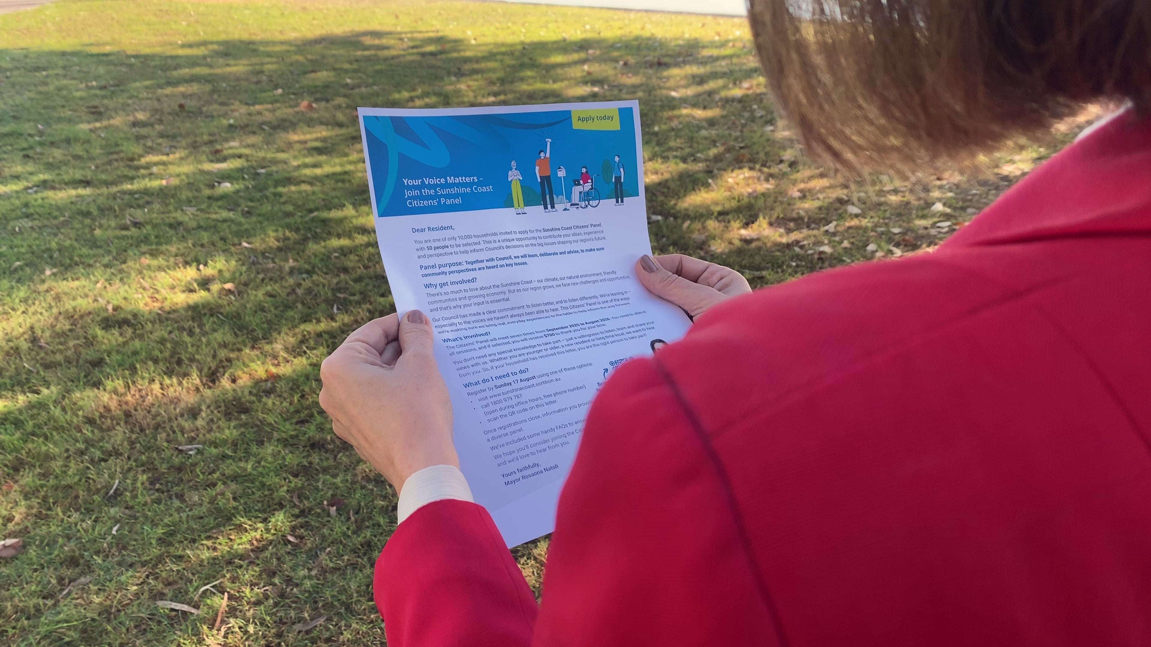 The letter, viewed over a shoulder, titled "Your Voice Matters - Join the Sunshine Coast Citizens' Panel".