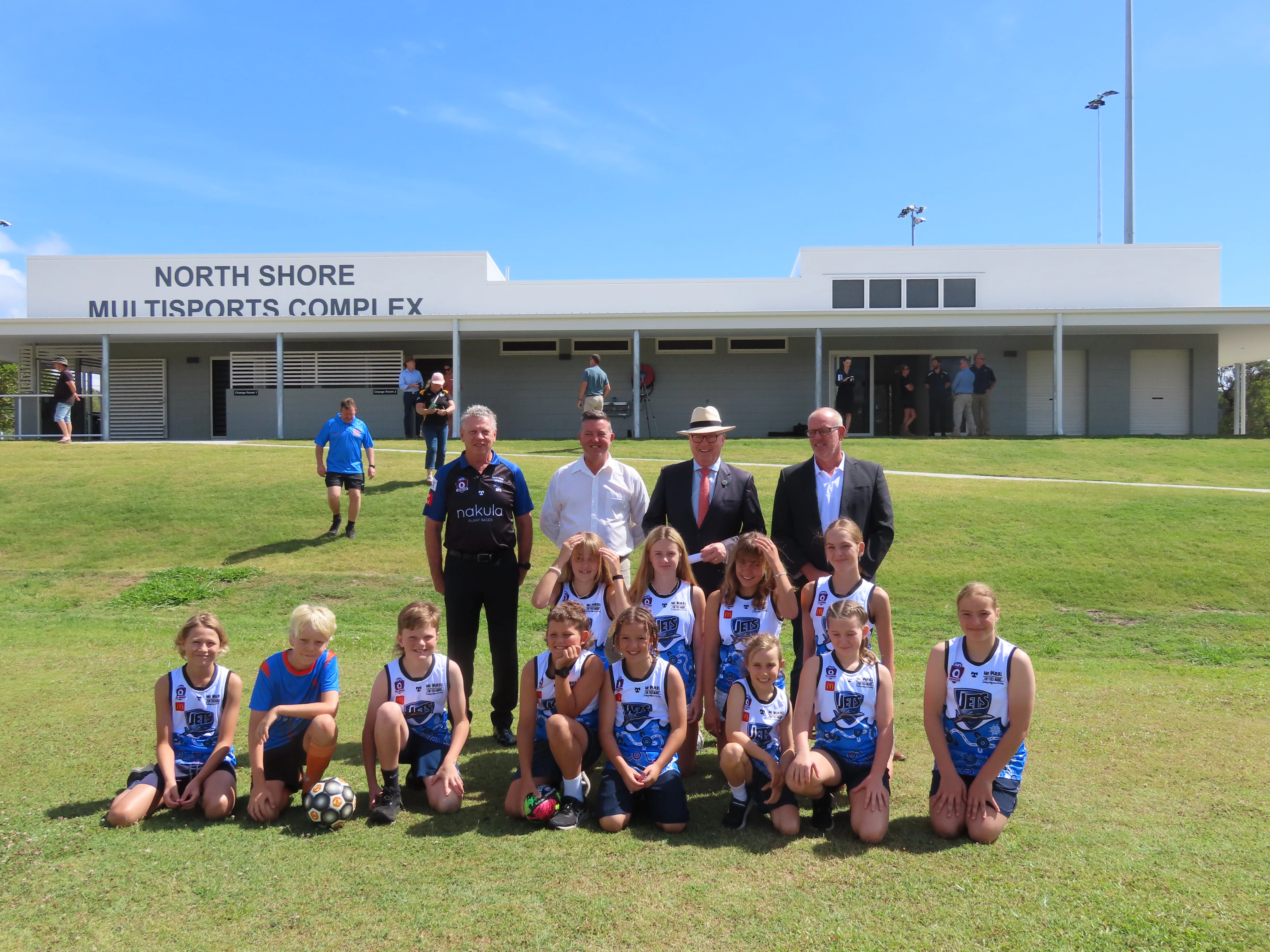 North Shore AFL Jets vice-president Warren Selvage, MP Robert Skelton, Mayor Mark Jamieson and Cr Jason O'Pray pictured with local players from AFL Jets and SunCity Soccer.