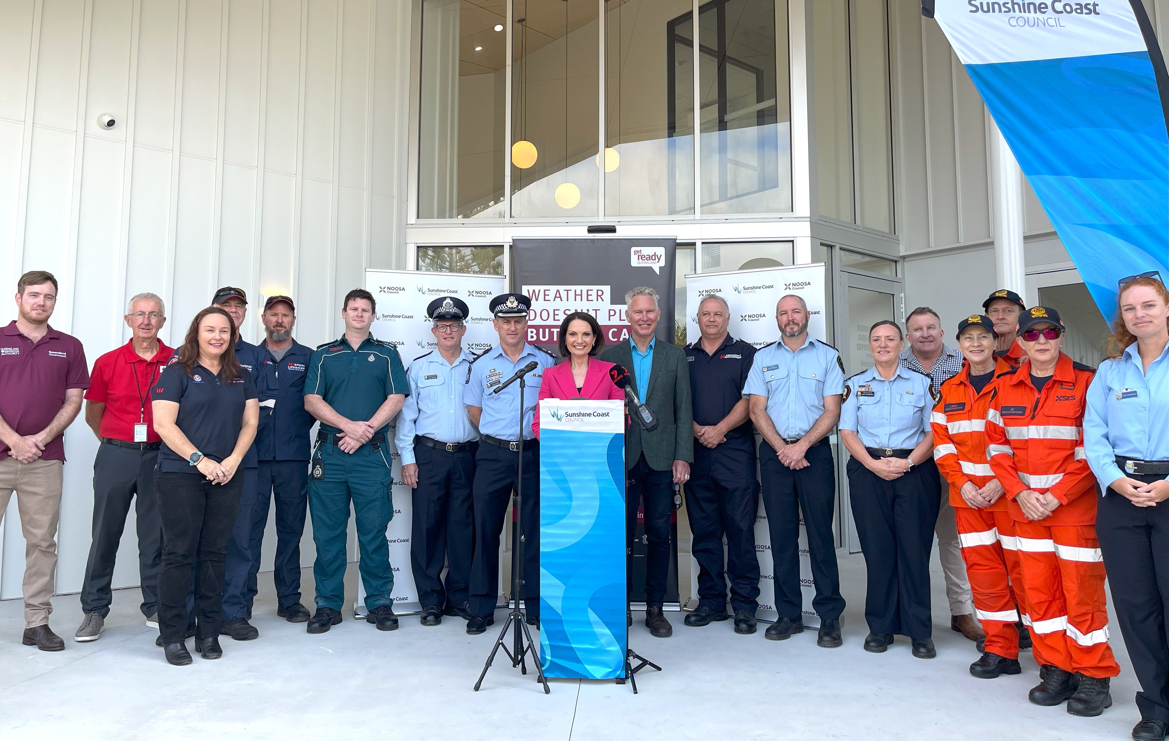 Sunshine Coast Mayor Natoli stands behind a podium with Noosa Mayor Wilkie with emergency service representatives to launch this year's Get Ready Week.
