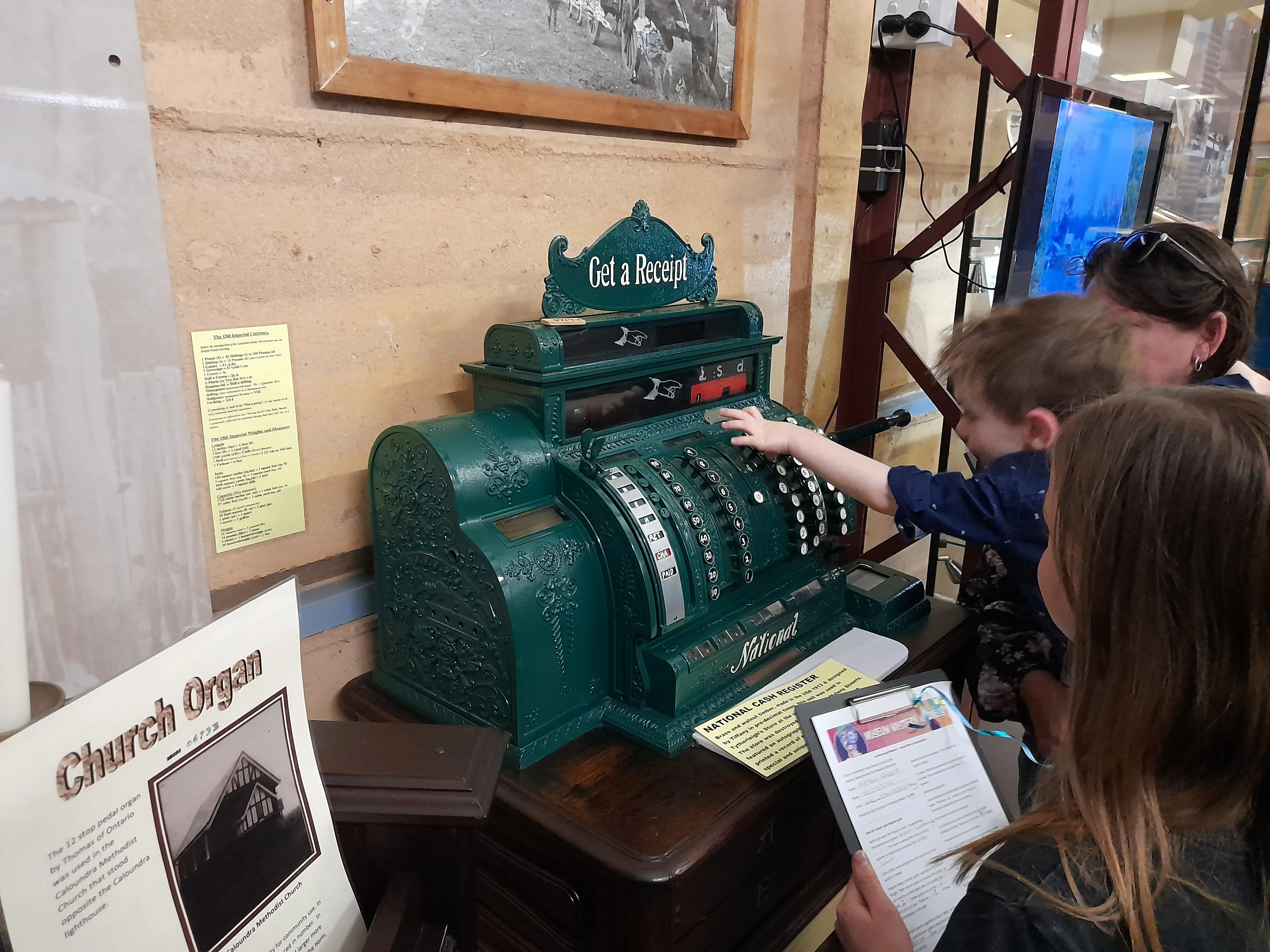 Children use an old cash register