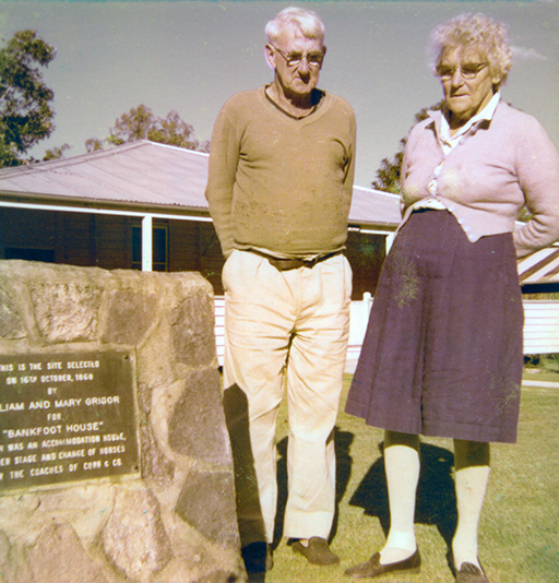 Mary and Jack standing beside the 100th anniversary memorial cairn at the front of Bankfoot House, 1977.