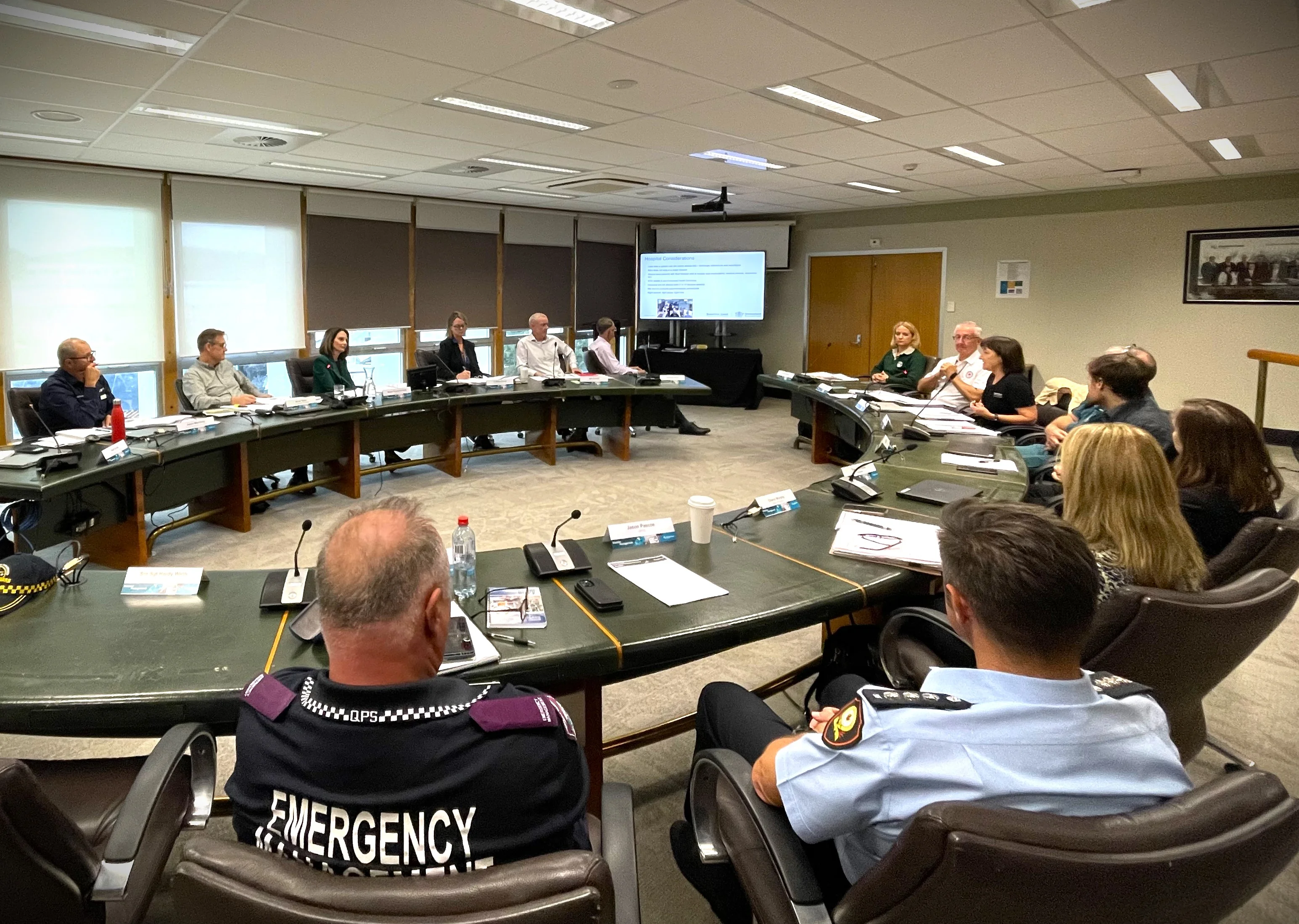 Sunshine Coast's emergency responders sit around a large round table.